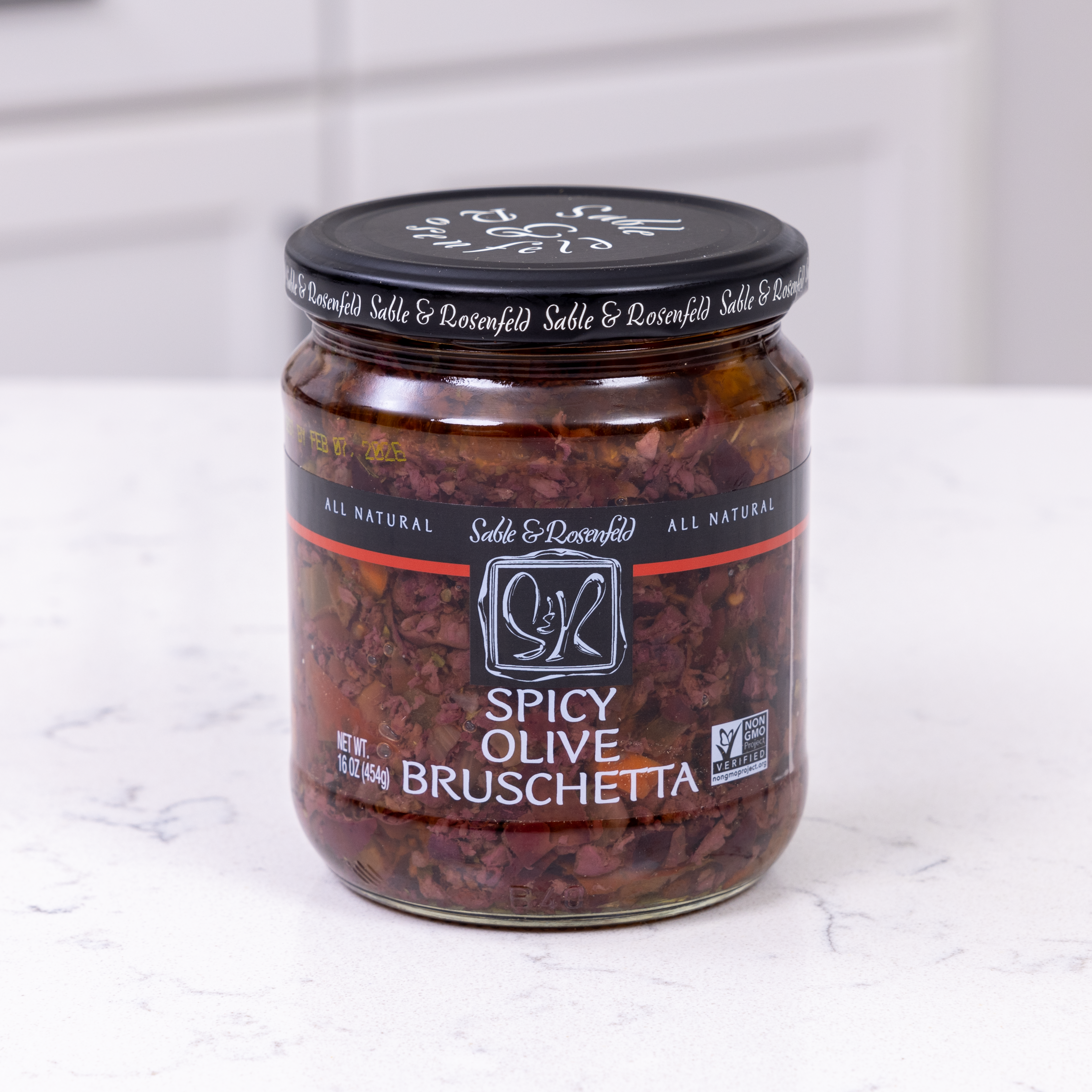 A jar of Spicy Olive Bruschetta with all-natural ingredients