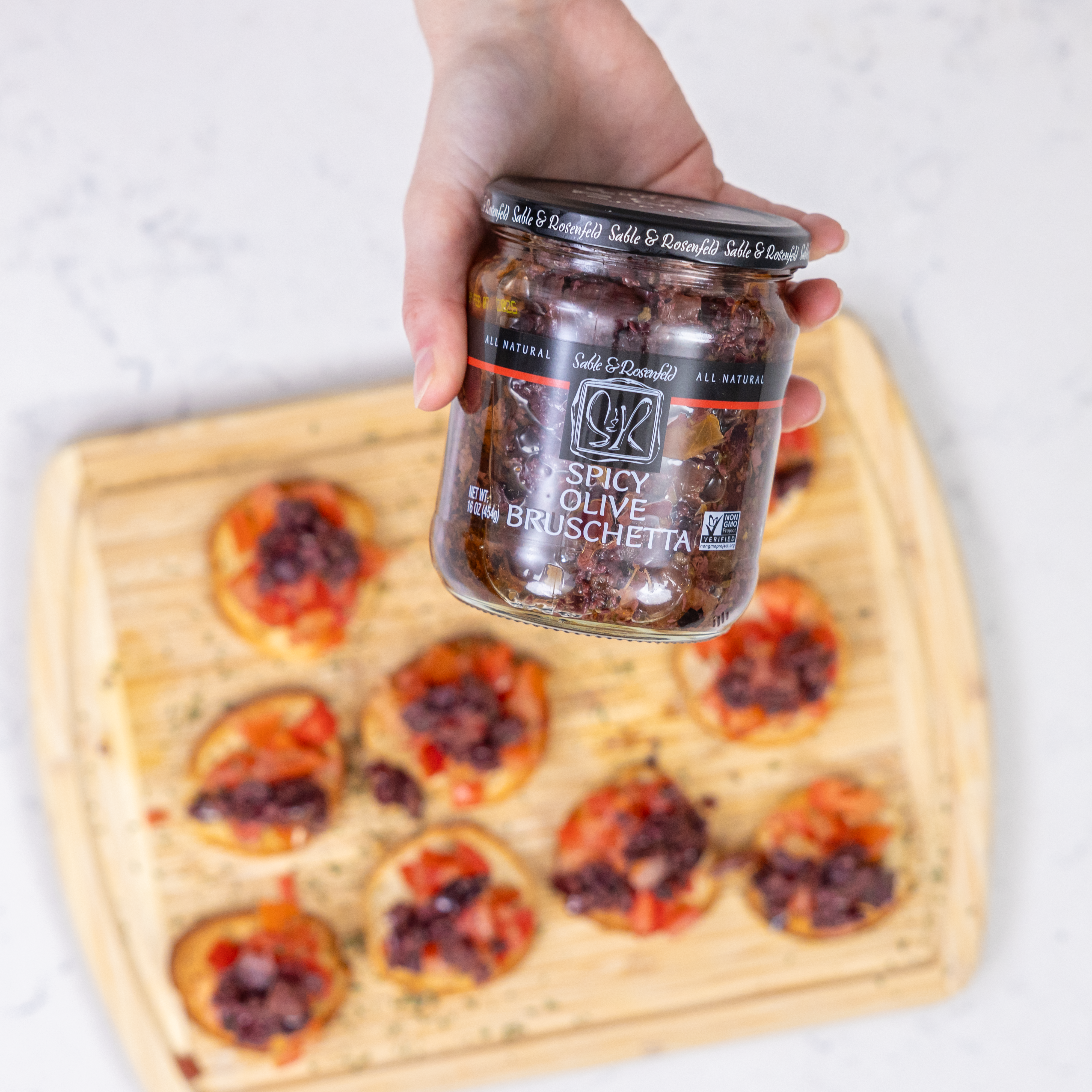Gourmet Spicy Olive Bruschetta with capers, red bell peppers, and garlic